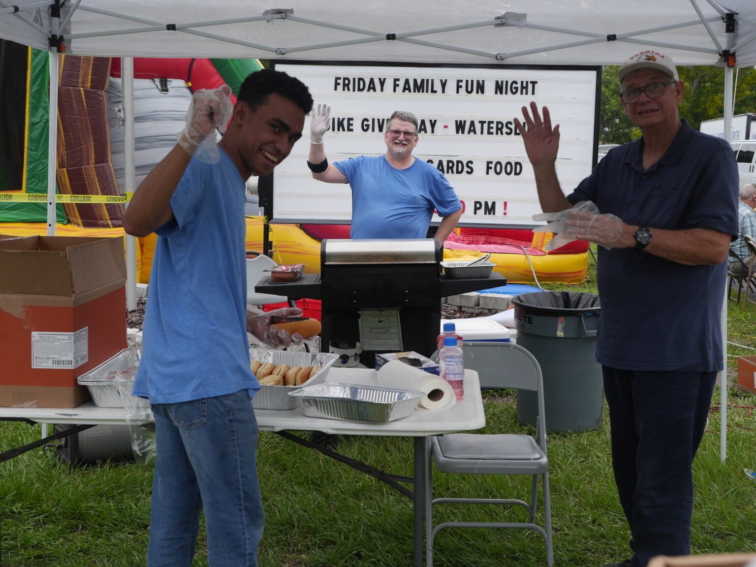 Volunteers serving food at outdoor community event